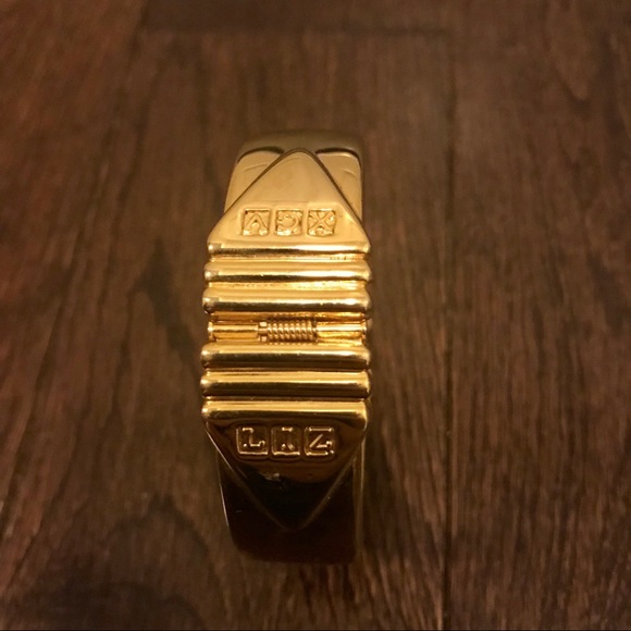 Liz Claiborne Jewelry - Liz Claiborne gold hinge bangle stamped w/ XCV